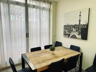 a dining room with a table and chairs at Sweet BCN Borrell in Barcelona