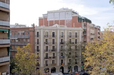 a tall white building in the middle of buildings at Sweet BCN Sagrada Familia in Barcelona