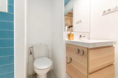a bathroom with a toilet and a sink at Amazing flat in Barceloneta with private terrace 2-2 in Barcelona