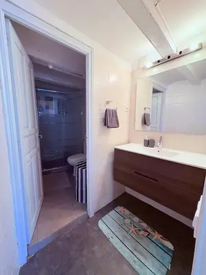 a bathroom with a sink and a mirror at Stunning flat for 6 people 3 blocks from the beach plus welcome breakfast in Barcelona