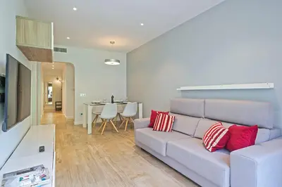 a living room with a couch and a table at Habitat Apartments Pau in Barcelona