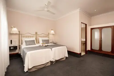 a bedroom with a large bed and a mirror at Hotel Continental Barcelona in Barcelona
