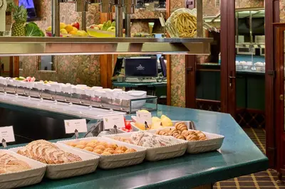 a bakery with many different types of pastries on a counter at Hotel Continental Barcelona in Barcelona