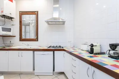 a kitchen with a sink and a counter top at Canela Homes BARCELONA GÒTIC in Barcelona
