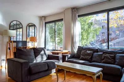 a living room with a couch and a table at Canela Homes BARCELONA ICÀRIA in Barcelona
