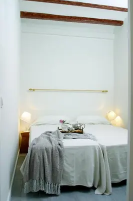 a white bedroom with a white bed with a blanket on it at ClassBedroom Barcelona Beach Apartments in Barcelona