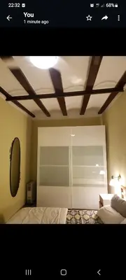 a picture of a bedroom with a bed and a mirror at Apartment in Downtown 2 bedrooms AC 30 nigths min in Barcelona