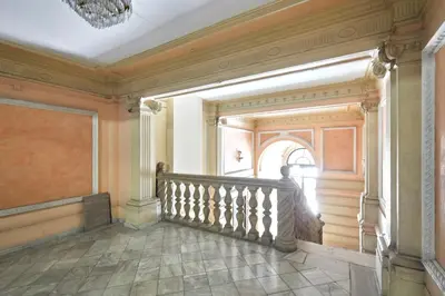 a hallway with a staircase in a building at 