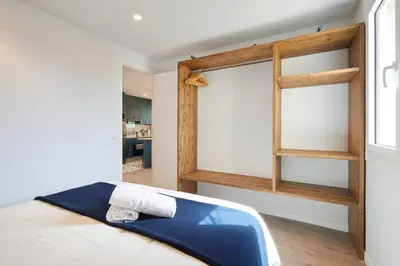 a bedroom with a bed and a book shelf at 