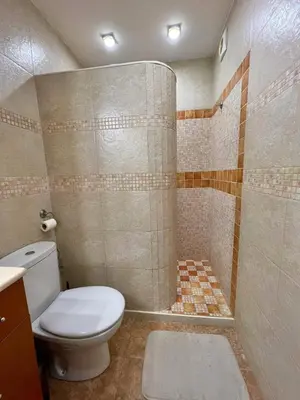 a bathroom with a toilet and a shower at Opening Doors Premiá Beach - Sol & playa cerca Barcelona in Premiá de Mar