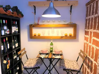 two bottles of wine in a bucket on a table at Barcelona beach apartment in Sant Adria de Besos
