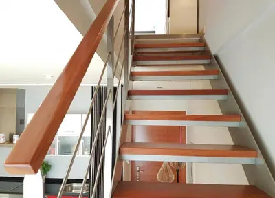 a staircase in a house with wooden steps at Penthouse 100m from Sea with Terrace, Near BCN in Mataró