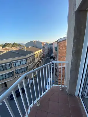 a balcony with a view of a street and buildings at Habitacion en piso de 3 habitaciones, Manresa Near train Barcelona 2 in Manresa