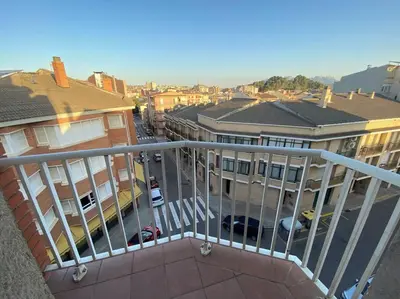 a balcony with a view of a parking lot with buildings at Habitacion en piso de 3 habitaciones, Manresa Near train Barcelona 2 in Manresa
