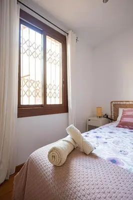 a bedroom with a bed with a towel on it at 2 bedroom apartment Barcelona Center in Barcelona
