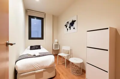 a bathroom with a sink and a mirror and a tub at 2762 - AB Park Guell Apartment B-II in Barcelona