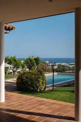 a view of a swimming pool from a building at Sea View Villa with Spa & BBQ in Badalona