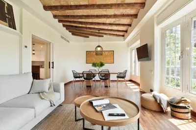 a living room with a couch and a table at Enjoy Apartments La Riera Principal in Barcelona