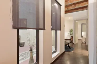 a room with a window with a vase in a room at Enjoy Apartments Urban Retreat Valencia 1 in Barcelona