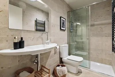 a bedroom with a bed with a book on it at Zamora - 3 bedrooms in Eixample Esquerra in Barcelona