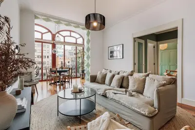 a kitchen with a table and chairs and a large window at Zamora - 3 bedrooms in Eixample Esquerra in Barcelona