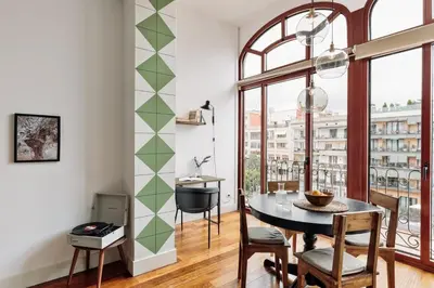 a bedroom with green walls and a bed with fruit on it at Zamora - 3 bedrooms in Eixample Esquerra in Barcelona