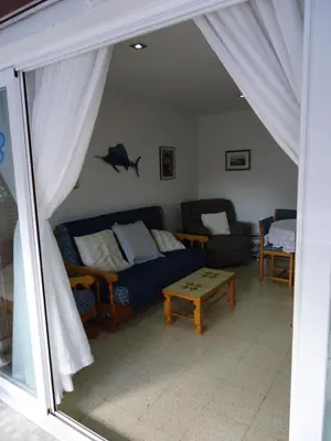 a living room with a couch and a table at brisa mar in San Pol de Mar
