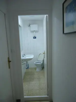 a bathroom with a toilet and a sink at brisa mar in San Pol de Mar