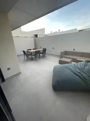 a room with a bed and a table and chairs at Apartamento de una habitación con terraza grande cerca de Barcelona in Badalona