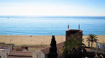a view of the beach and the ocean from a building at Carmen Seaview & Beach - Apartment in Montgat