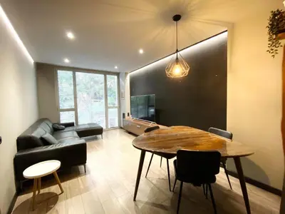 a living room with a table and a couch at Gaudi Comfort in Barcelona