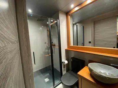 a bathroom with a sink and a glass shower at Gaudi Comfort in Barcelona