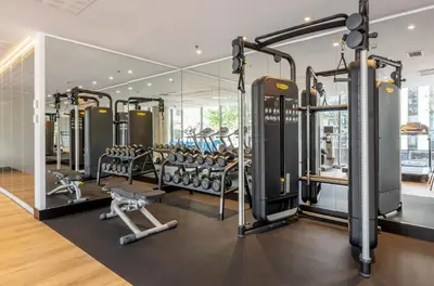 a gym with a row of tread machines at Ilunion Barcelona in Barcelona