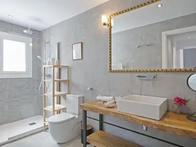 a bathroom with a sink and a mirror and a toilet at Apartamento exclusivo a 15 min de Barcelona in Sant Cugat del Vallès