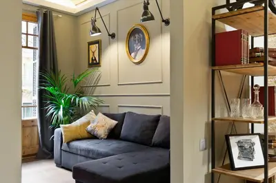 a living room with a blue couch at Sagrada266 by chicStays in Barcelona