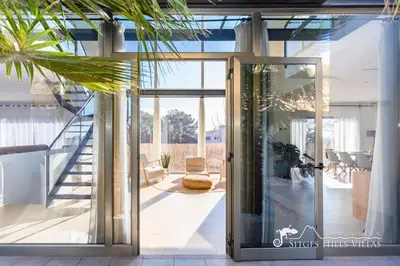 a gym with a ping pong table and a ping pong ball at Designer Villa Elodie with private pool and space in Olivella