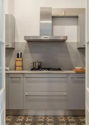 a kitchen with a stove with a pot on it at Canela Homes BARCELONA LIGHT in Barcelona
