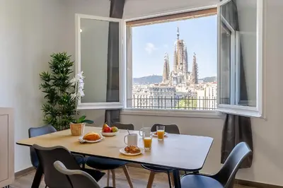 a dining room table with a view of the city at 4213 - AB Sagrada Familia Views VI-I in Barcelona