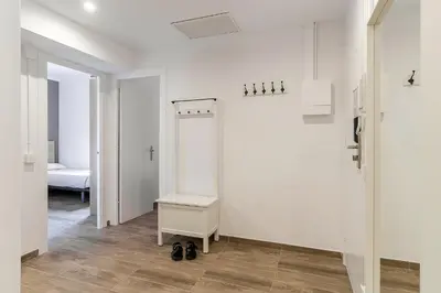 a room with white walls and a room with a table at 4213 - AB Sagrada Familia Views VI-I in Barcelona