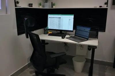 a desk with a computer and a laptop on it at Work Stay in Gavà