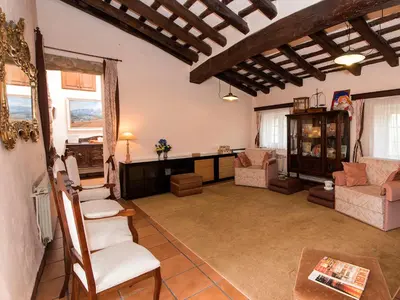 a living room with a couch and chairs and a table at Holiday Home Can Trullas by Interhome in Viladecaballs