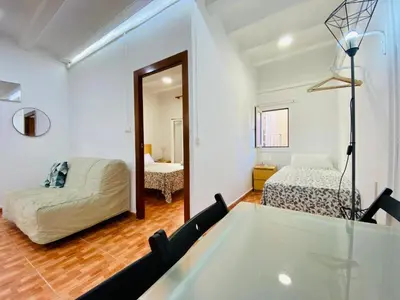 a room with a bed and a glass table at 030 apartameto 4-1 in Barcelona