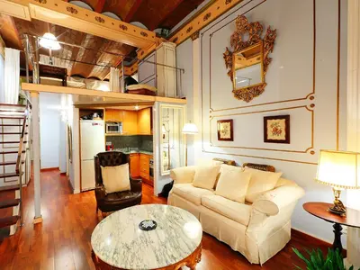 a living room with a couch and a table at Apartment Plaza de Catalunya - Pso- de Gracia by Interhome in Barcelona