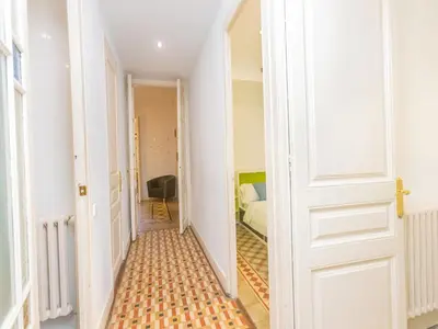 a hallway with a door leading to a bedroom at Apartment Eix-Dret-Roger de LLuria-Valencia by Interhome in Barcelona