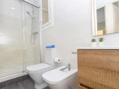 a bathroom with a toilet and a sink and a shower at Apartment Eix-Dret-Roger de LLuria-Valencia by Interhome in Barcelona