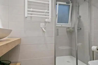 a bathroom with a shower and a sink at Boutique Plaza Catalonia Suites Cornellá in Cornellà de Llobregat