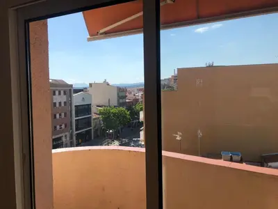 a view of a city from a window at Tucan tropical in Sabadell