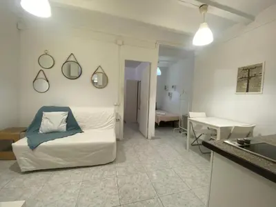 a living room with a couch and a table at 022 Center Barca 1,1 in Barcelona