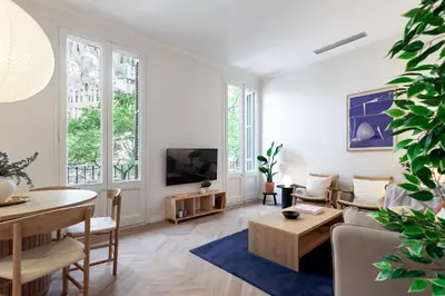 a living room with a couch and a table at Click&Flat Gaudi Dream II in Barcelona