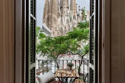 a balcony with a view of a castle at Click&Flat Gaudi Dream II in Barcelona